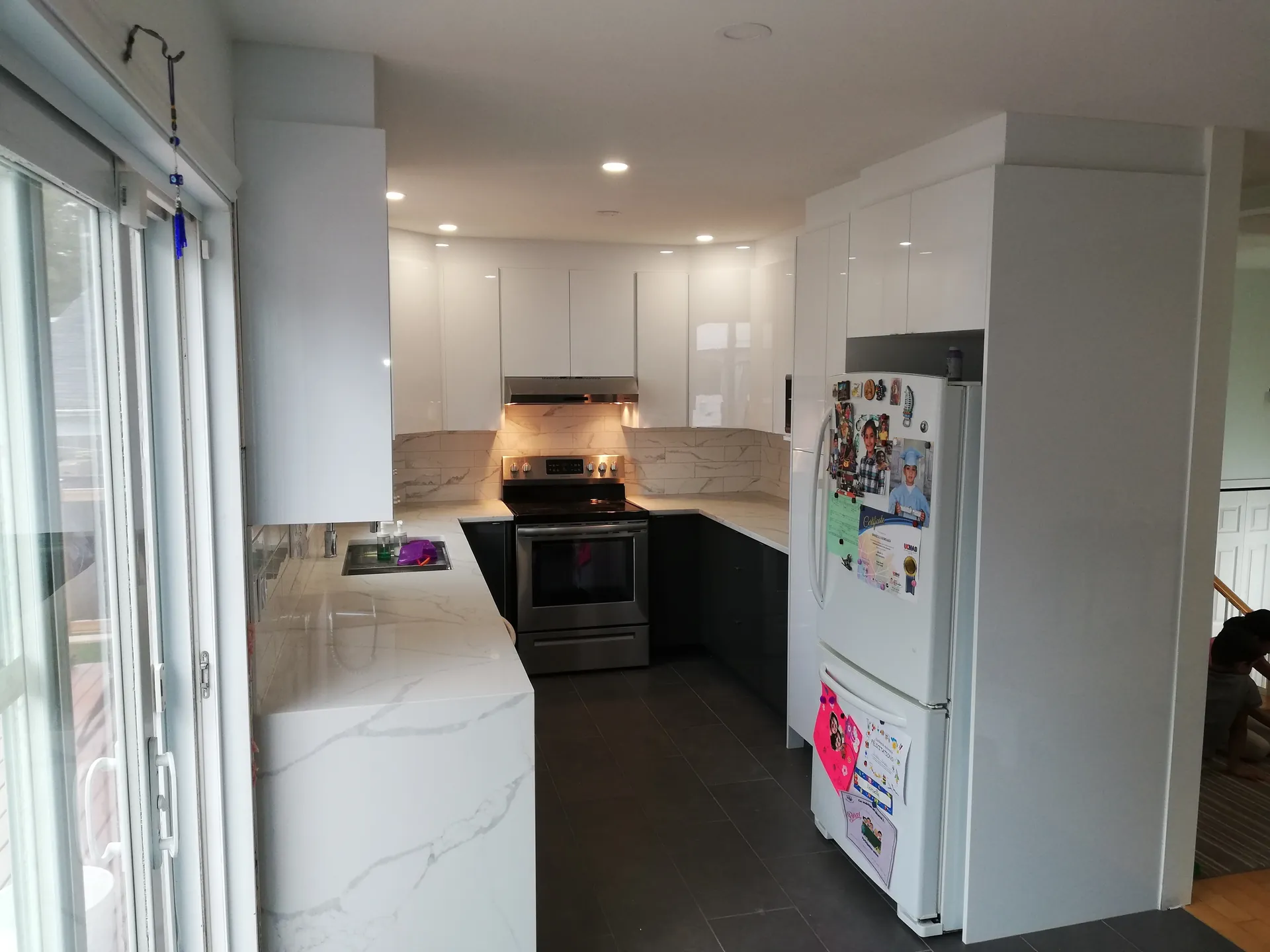 Black and white kitchen renovation in Laval
